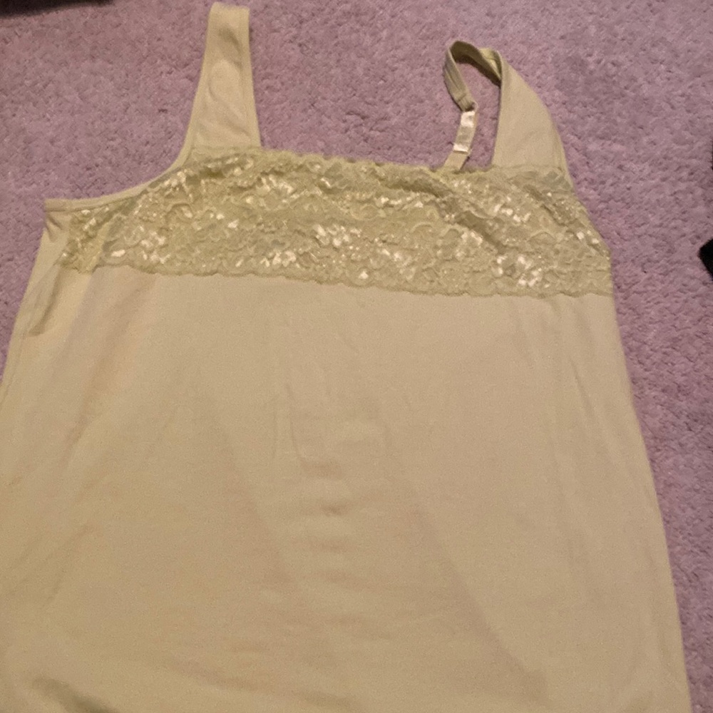 Green tank top with lace on top and adjustable straps